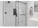 Modern shower with a glass door and beautiful marble accents, creating a spa-like experience at 5954 Crestview Ave, Indianapolis, IN 46220