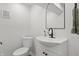 Modern bathroom features a sleek vanity, black fixtures, and tile flooring at 5954 Crestview Ave, Indianapolis, IN 46220