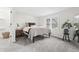 Cozy bedroom with a queen-sized bed, soft carpet, and plenty of natural light from the double windows at 5954 Crestview Ave, Indianapolis, IN 46220