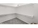 Walk-in closet with ample shelving and neutral carpet, ready for all your storage needs at 5954 Crestview Ave, Indianapolis, IN 46220