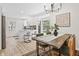 An open dining room sits next to the kitchen with lots of natural light at 5954 Crestview Ave, Indianapolis, IN 46220
