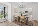 Sunlit dining room with modern chandelier and views of the yard at 5954 Crestview Ave, Indianapolis, IN 46220