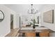 Charming dining room showcases a stylish chandelier and an inviting rustic table at 5954 Crestview Ave, Indianapolis, IN 46220