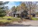 Well-manicured front yard, freshly painted dark siding, and an detached garage at this renovated house at 5954 Crestview Ave, Indianapolis, IN 46220