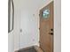 Welcoming foyer featuring a stylish front door with glass panes, alongside a convenient coat closet at 5954 Crestview Ave, Indianapolis, IN 46220