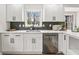 Modern kitchen featuring white cabinetry, stainless steel appliances, and stylish countertops at 5954 Crestview Ave, Indianapolis, IN 46220