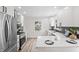 Modern kitchen with stainless steel appliances, quartz counters, and classic white cabinets at 5954 Crestview Ave, Indianapolis, IN 46220