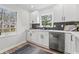 Bright kitchen featuring white cabinets, stainless steel appliances, and stylish countertops at 5954 Crestview Ave, Indianapolis, IN 46220