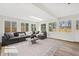 Sun-filled living room with large windows and a comfortable sectional sofa at 5954 Crestview Ave, Indianapolis, IN 46220