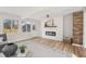 Cozy living room featuring a fireplace and a view of the backyard at 5954 Crestview Ave, Indianapolis, IN 46220