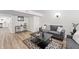 Inviting living room featuring a stylish coffee table, wood-look floors, and natural light at 5954 Crestview Ave, Indianapolis, IN 46220