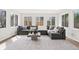 Bright living room boasts large windows and a comfortable sectional sofa at 5954 Crestview Ave, Indianapolis, IN 46220