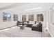 Bright living room with a large grey sectional sofa, decorative rug, and plenty of natural light at 5954 Crestview Ave, Indianapolis, IN 46220