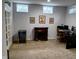 Finished basement with a decorative fireplace, desk, and beverage cooler at 5983 Clearview Dr, Carmel, IN 46033