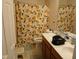 Bathroom features a dual sink vanity and cheerful lemon-themed shower curtain for a bright touch at 5983 Clearview Dr, Carmel, IN 46033