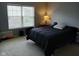 Serene bedroom with a large window and soft lighting create a relaxing and comfortable space at 5983 Clearview Dr, Carmel, IN 46033