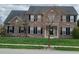 Two-story brick home with black shutters, manicured lawn, and well-maintained landscaping at 5983 Clearview Dr, Carmel, IN 46033