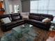 Spacious living room with a large sectional sofa and glass coffee table at 5983 Clearview Dr, Carmel, IN 46033