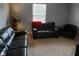Inviting living room features plush leather seating and natural light for comfortable relaxation at 5983 Clearview Dr, Carmel, IN 46033