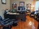 Home office with hardwood floors, large desk, and ergonomic chair at 5983 Clearview Dr, Carmel, IN 46033