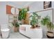Bathroom featuring a soaking tub and decorative wall art at 6185 Evanston Ave, Indianapolis, IN 46220