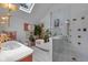 Modern bathroom showcasing a luxurious soaking tub, glass-enclosed shower, and stylish fixtures at 6185 Evanston Ave, Indianapolis, IN 46220