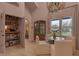 Bright breakfast nook with hardwood floors, bar shelving, disco ball and seating for four at 6185 Evanston Ave, Indianapolis, IN 46220