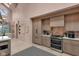 Modern kitchen featuring stainless appliances, quartz countertops, and sleek custom cabinetry at 6185 Evanston Ave, Indianapolis, IN 46220