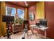 Contemporary home office featuring natural light, wood floors and modern desk at 6185 Evanston Ave, Indianapolis, IN 46220