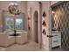 Chic powder room features a unique vanity and stylish geometric wallpaper, adding a touch of luxury at 6185 Evanston Ave, Indianapolis, IN 46220