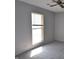 Bedroom with gray carpet and walls, and a window with blinds at 6512 Lupine Ter # 6512, Indianapolis, IN 46224