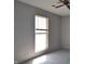 Bedroom featuring gray carpet and walls, a window with blinds, and a ceiling fan at 6512 Lupine Ter # 6512, Indianapolis, IN 46224
