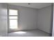 Bedroom featuring gray carpet and walls and a window with blinds at 6512 Lupine Ter # 6512, Indianapolis, IN 46224