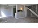 Living room featuring a ceiling fan, floating shelves, and wood-look floors at 6512 Lupine Ter # 6512, Indianapolis, IN 46224