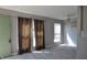Open living area with gray walls, window coverings, and wood-look floors at 6512 Lupine Ter # 6512, Indianapolis, IN 46224