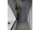 Staircase with black railings and gray walls at 6512 Lupine Ter # 6512, Indianapolis, IN 46224