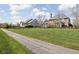 View of the house and other homes across the grassy common backyard at 6645 Braemar N Ave, Noblesville, IN 46062