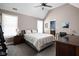 Spacious bedroom featuring a ceiling fan, ample natural light, and a view into an ensuite bathroom at 6645 Braemar N Ave, Noblesville, IN 46062