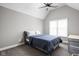 Bright bedroom features a vaulted ceiling, ceiling fan, plush bed, and a window with lots of natural light at 6645 Braemar N Ave, Noblesville, IN 46062