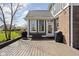 Outdoor deck with grill and storage box, attached to a brick home with white trim and windows at 6645 Braemar N Ave, Noblesville, IN 46062
