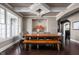 Formal dining room with dark floors, coffered ceilings, chandelier, and a large window at 6645 Braemar N Ave, Noblesville, IN 46062