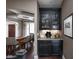 Stylish bar area with elegant cabinetry and a view into the adjacent dining room at 6645 Braemar N Ave, Noblesville, IN 46062