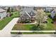 Beautifully landscaped home with lush green lawn, flowering trees, and a well-maintained exterior at 6645 Braemar N Ave, Noblesville, IN 46062