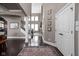 Spacious foyer with dark floors, high ceilings, and white trim at 6645 Braemar N Ave, Noblesville, IN 46062