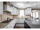 Bright and open kitchen with granite countertops, stainless appliances, and white cabinetry at 6645 Braemar N Ave, Noblesville, IN 46062