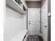 Inviting mud room with built-in storage, coat hooks, and a bench, perfect for organization at 6645 Braemar N Ave, Noblesville, IN 46062