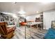 Finished basement featuring an open living space with gray vinyl floors, recessed lighting, and neutral paint at 6911 N Tuxedo St, Indianapolis, IN 46220