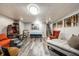 Inviting finished basement featuring gray vinyl floors, plush seating, and an entertainment area at 6911 N Tuxedo St, Indianapolis, IN 46220