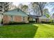 Well-maintained home featuring brick accents and a verdant, inviting front yard at 6911 N Tuxedo St, Indianapolis, IN 46220