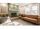 Stylish living room with decorative fireplace, hardwood floors and window views to the outdoor greenery at 6911 N Tuxedo St, Indianapolis, IN 46220
